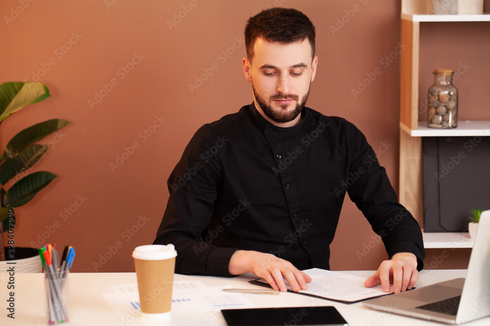 Employee works at the computer in the office Employee works at the computer in the office