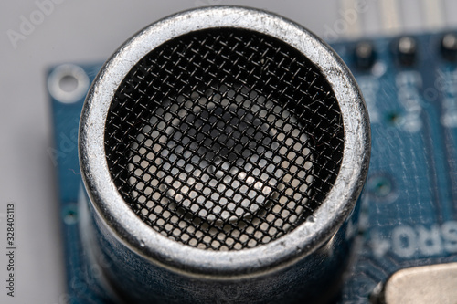 Macro close-up of one of the ultrasonic emmiters on a Ultrasonic Sensor Module for DIY projects Electronic Equipment