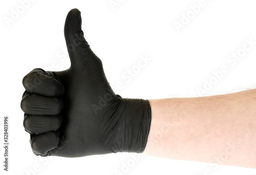 Hand in worker glove with thumb up isolated on white background photo