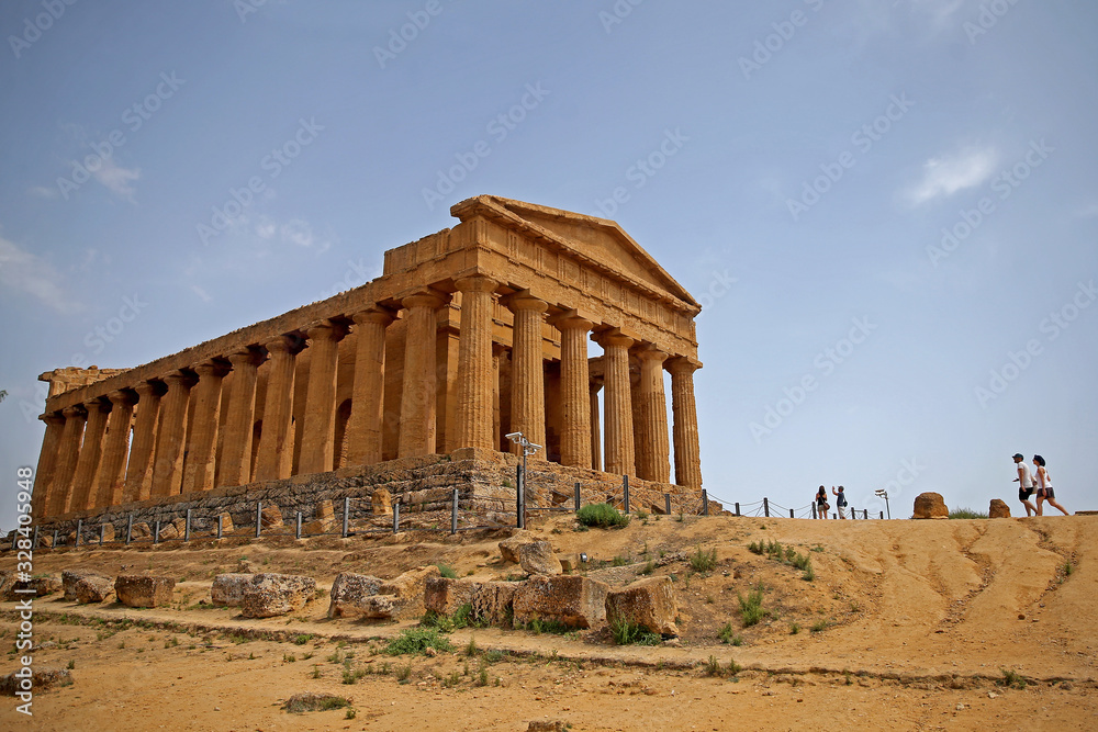 The Temple of Concordia, a 5th-century BC, Doric-style Ancient Greek temple in the Valley of the Temples, a UNESCO World Heritage Site in Agrigento, Sicily, Italy .