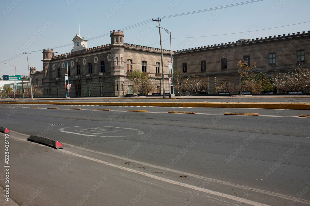 Urban landscape in the streets of Mexico City showing the avenue where the old Mexico City jail or Lecumberri palace construction and architecture of the city is located