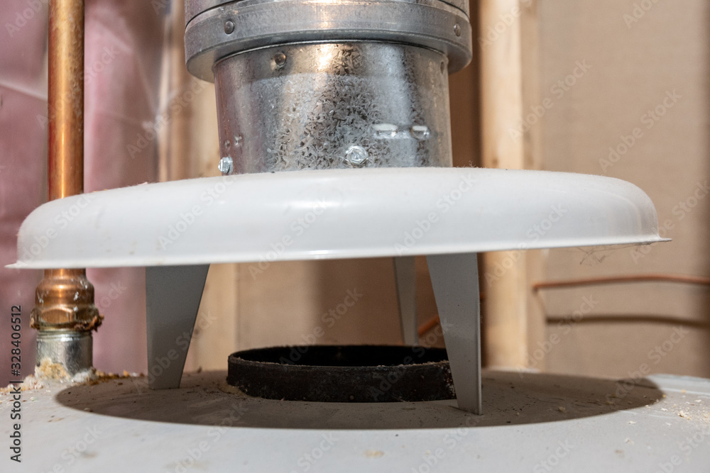 flue gas vent on top of hot water heater Stock Photo | Adobe Stock