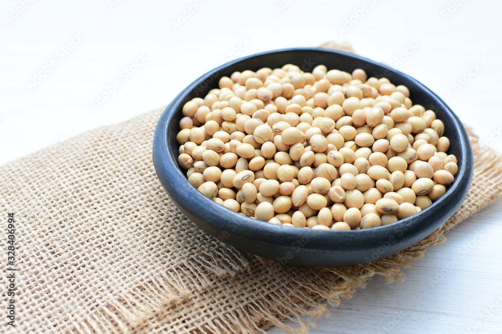 Raw soybeans (Glycine max) displayed in containers