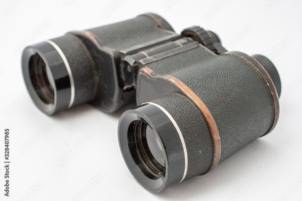 Old binocular isolated on white background Old binocular isolated on white background