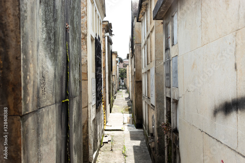 Old Crypts and mausoleums paths in sunny day at Cemetery located in downtown city © Alejandro Bernal