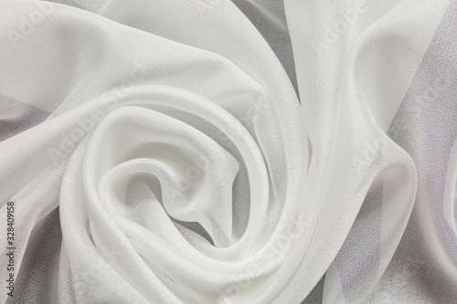 Shiny white cloth background white curly background photo