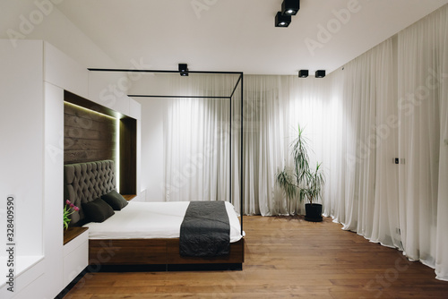 Modern luxury bedroom interior, beautiful minimalistic design king sized bed