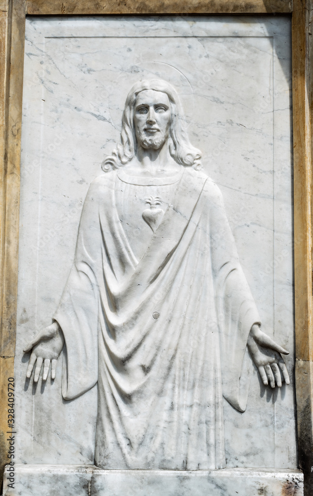 Old Ressurrected Jesus Christ High relief in cementery crypt entrance. 