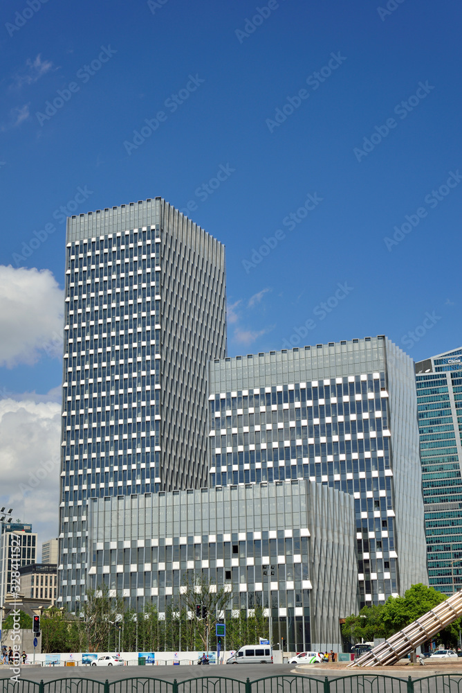 Blue sky, white clouds and modern urban architecture Blue sky, white clouds and modern urban architecture