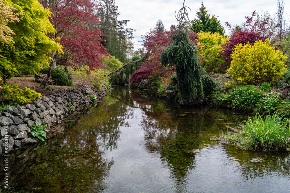 Beautiful ornamental garden landscaping with creek