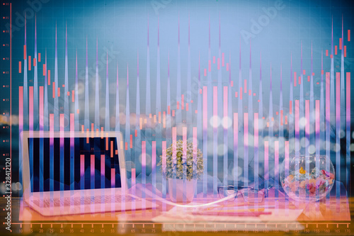 Forex graph hologram on table with computer background. Double exposure. Concept of financial markets.