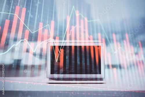 Forex graph hologram on table with computer background. Multi exposure. Concept of financial markets. © peshkova