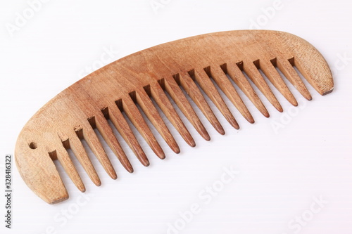 Beautiful wood comb isolated on white background