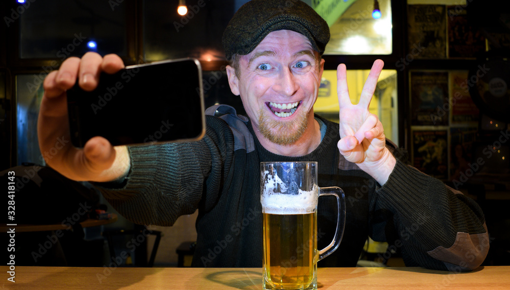 Guy and phone in the bar