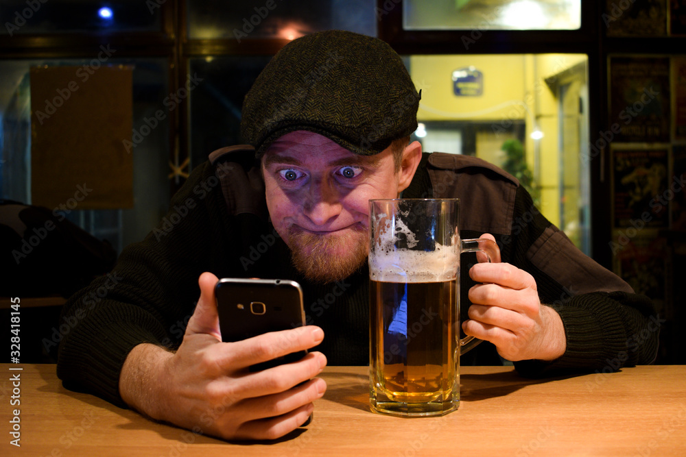 Guy and phone in the bar Guy and phone in the bar
