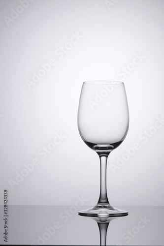 Empty glass clean isolated on white with space on left for copy