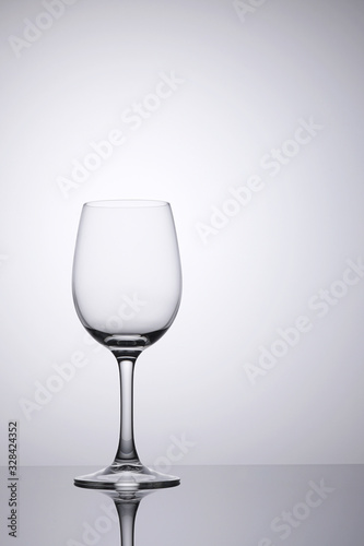 Empty glass clean isolated on white with space on right for copy