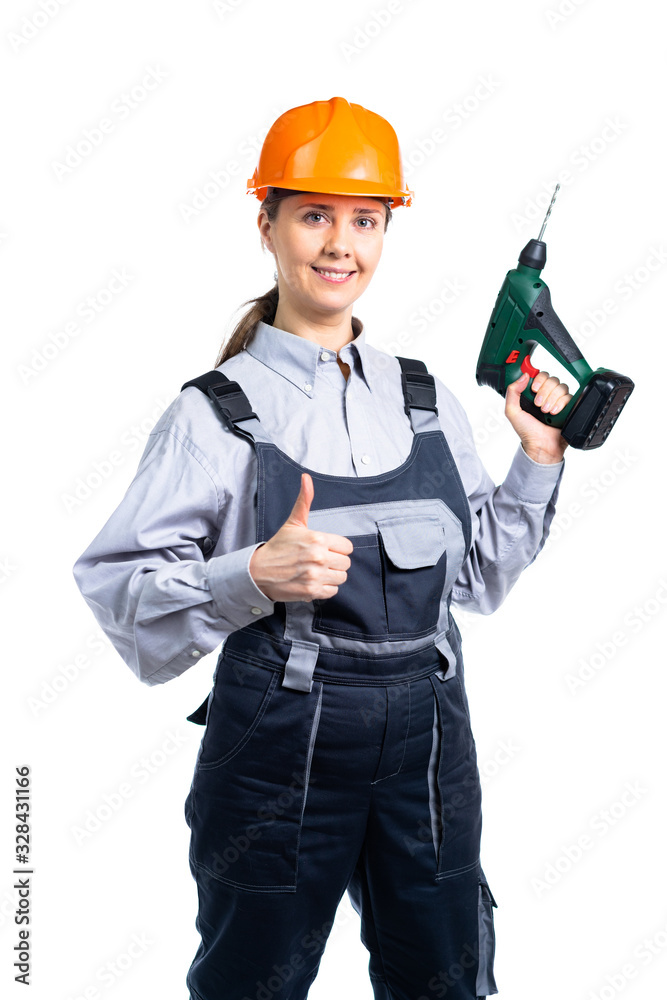 Builder engineer girl with a screwdriver in hand shows a gesture like hand. Isolated Builder engineer girl with a screwdriver in hand shows a gesture like hand. Isolated