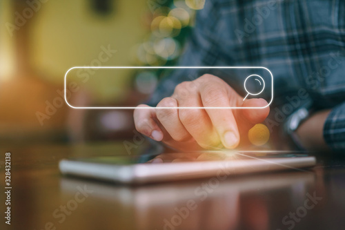 People hand using mobile phone or smartphone searching for information in internet online society web with search box icon.