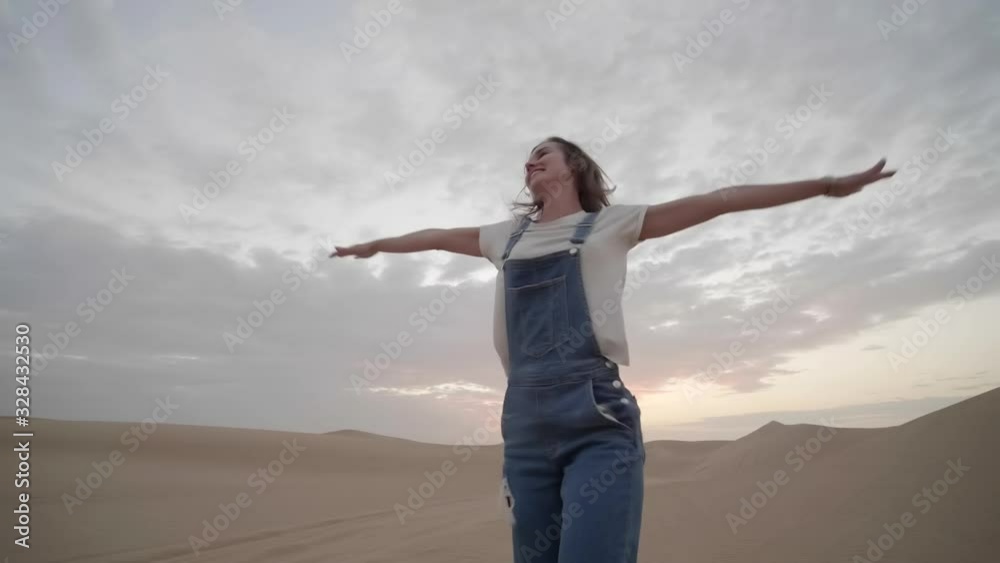 Happy girl in the desert of the arab emirates. Happy girl in the desert of the arab emirates.