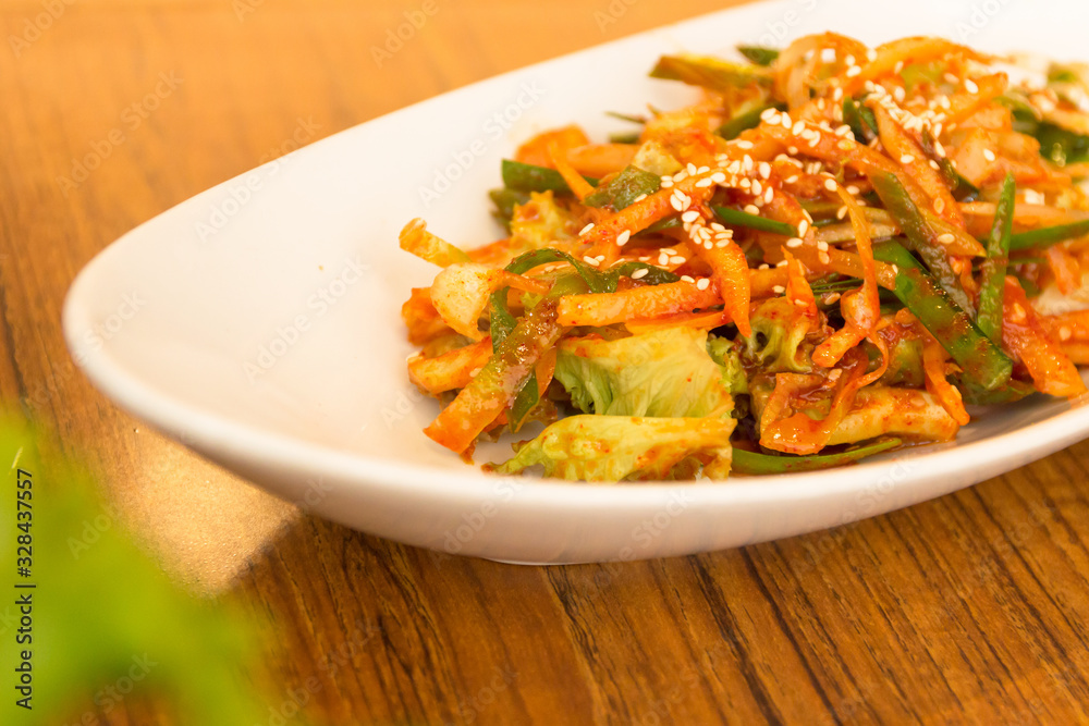 Kimchi made with bunching onion and bean sprouts, is a traditional fermented Korean side dish made of vegetables with a variety of seasonings (Pa Kimchi) Kimchi made with bunching onion and bean sprouts, is a traditional fermented Korean side dish made of vegetables with a variety of seasonings (Pa Kimchi)