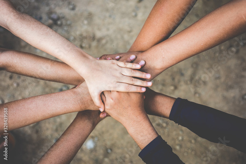 Group children hands together joining