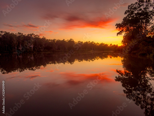 Fototapeta Naklejka Na Ścianę i Meble -  Colourful River Sunrise with Reflections