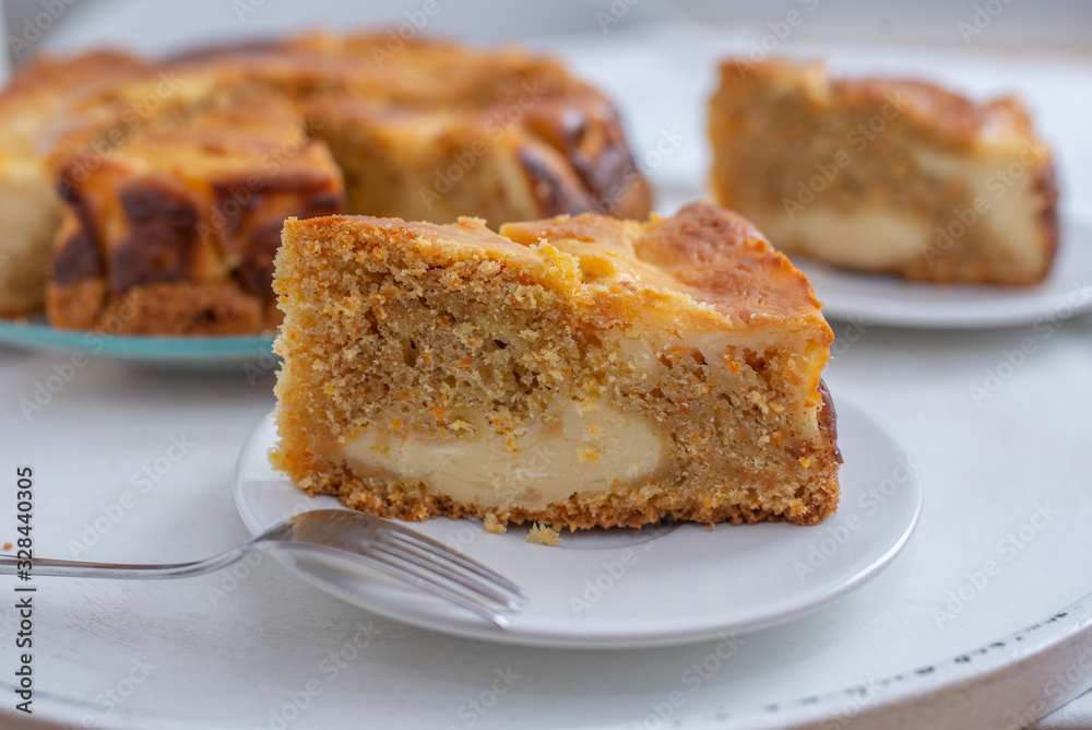home made carrot cake cheesecake on a table home made carrot cake cheesecake on a table