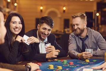 A group of wealthy young people gamble at a casino.