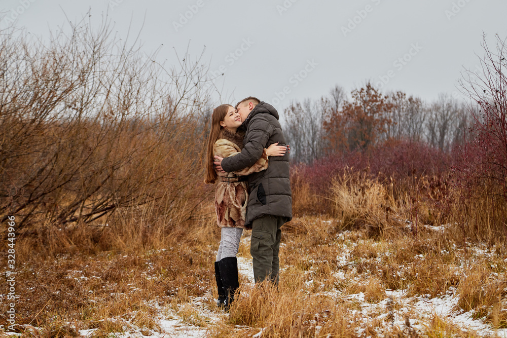 Romantic couple in love on autumn or winter walk Romantic couple in love on autumn or winter walk