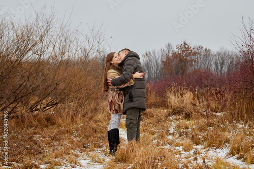 Romantic couple in love on autumn or winter walk