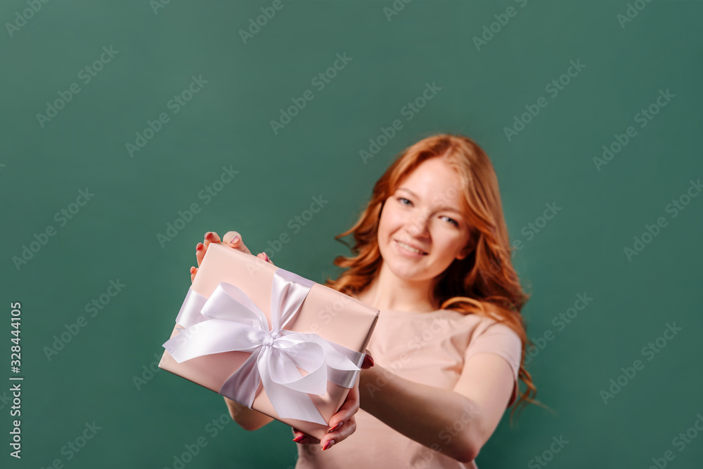 Young woman with a gift box in her hands. Young woman with a gift box in her hands.