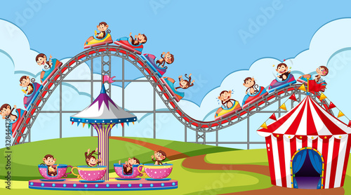 Scene with monkeys riding on roller coaster and cup spin in the park