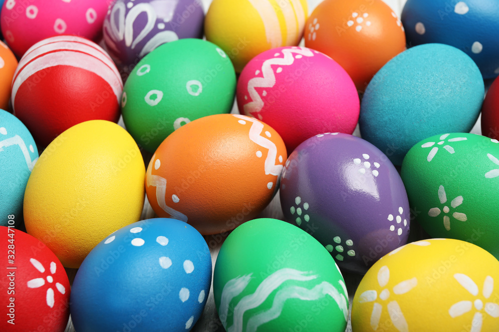 Many bright Easter eggs as background, closeup view
