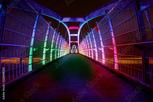 Bright led illuminate pedestrian walkway over highway at night