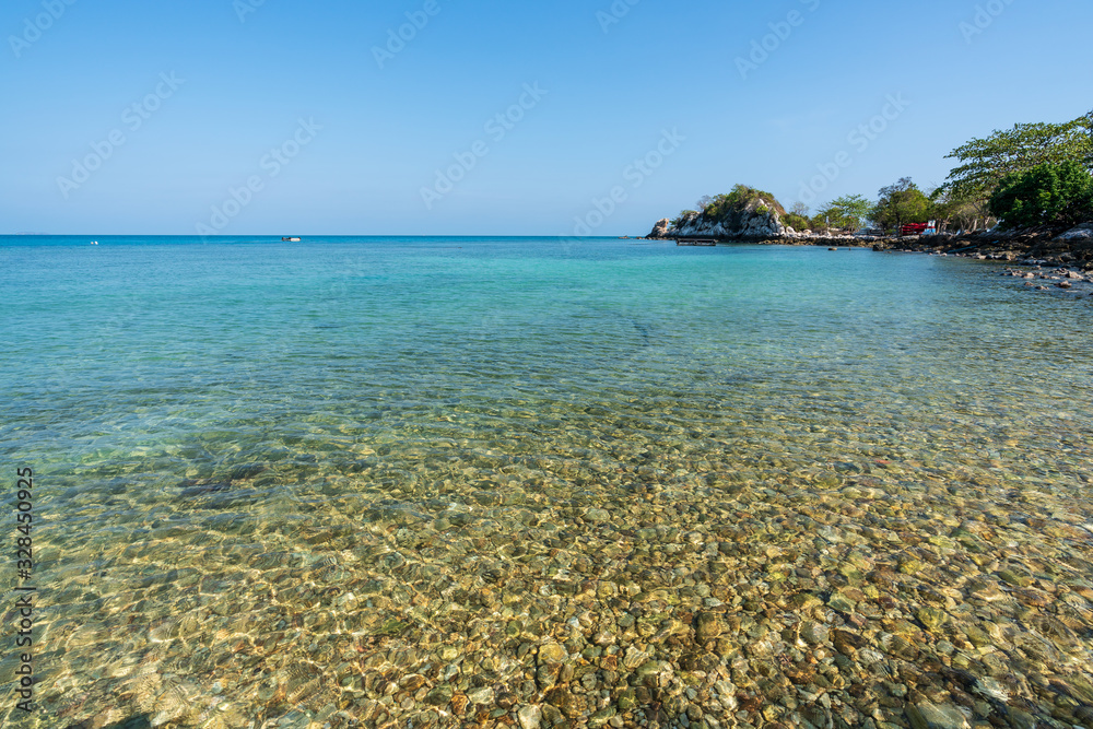 Fototapeta premium beautiful soft wave clear blue transparency sea ocean water and rocks at the bottom of the tropical paradise beach coast summer sea view at PP Island, Krabi, Phuket, Thailand.