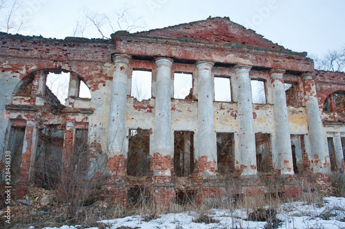 LENINGRAD REGION, RUSSIA - MARCH 9, 2014: view of the destroyed old buildings on the territory of the Blumentrostov and von Gersdorff estate in Kummolovo photo