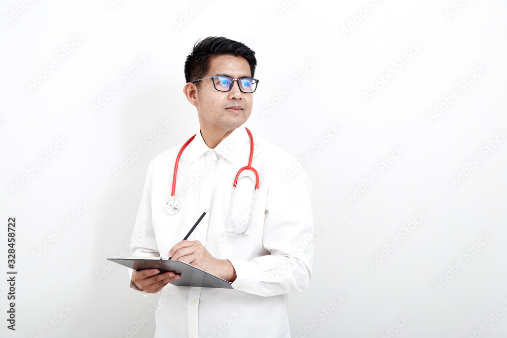 Male doctor writes on the document clipboard Male doctor writes on the document clipboard