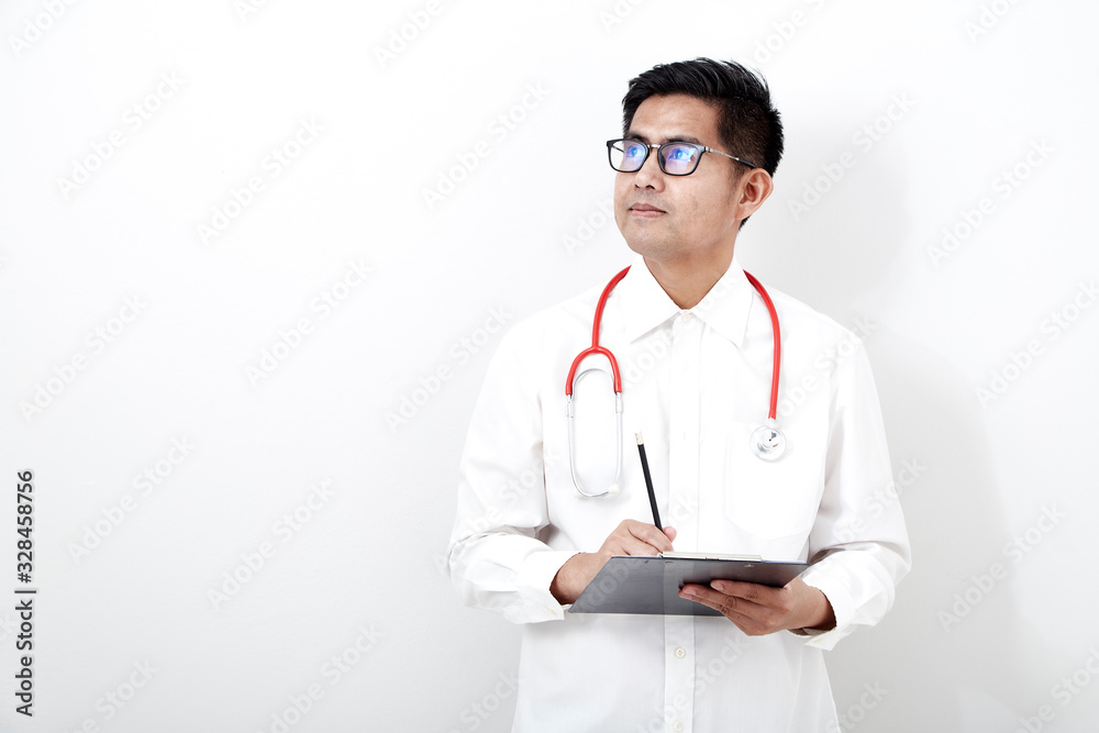 Male doctor writes on the document clipboard