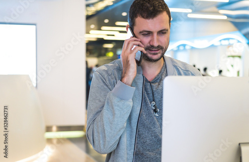 Customer assistant working in a call center or sales person at workplace talking over phone
