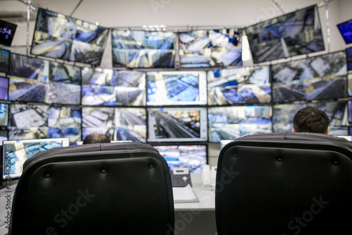 Empty office, desk, and chairs at a main CCTV security data center. photo