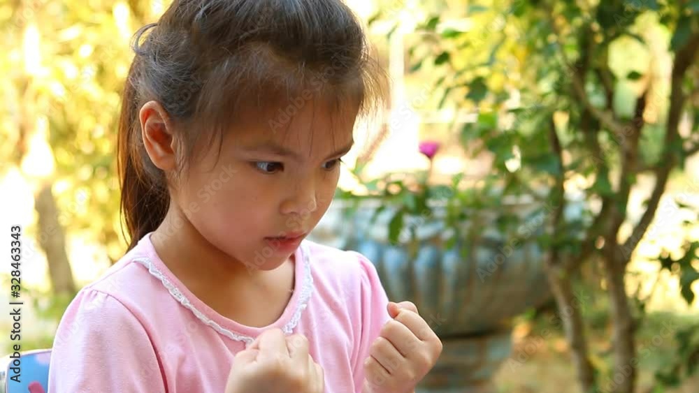 Thai little girl counting her fingers at home, Chiangmai Thailand Thai little girl counting her fingers at home, Chiangmai Thailand