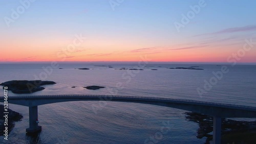 Atlantic Street Norway. Flying over a brigde, on to a beautiful sunset. photo