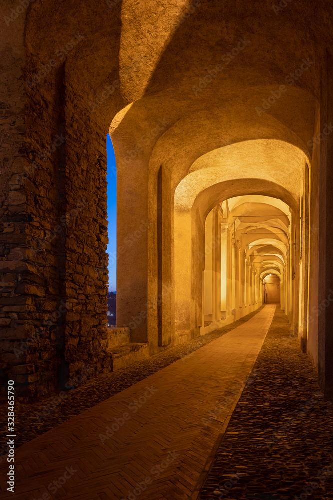 Archway in old town of Imperia in the night, Liguria region, Italy