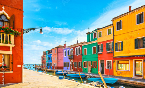 Fototapeta Naklejka Na Ścianę i Meble -  Burano island canal, colorful houses and boats in the Venice lagoon. Italy