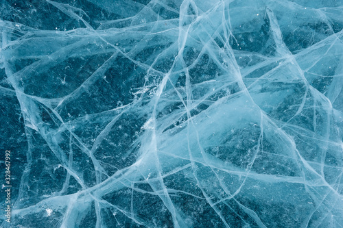 Cracks in the ice. Frozen lake surface.