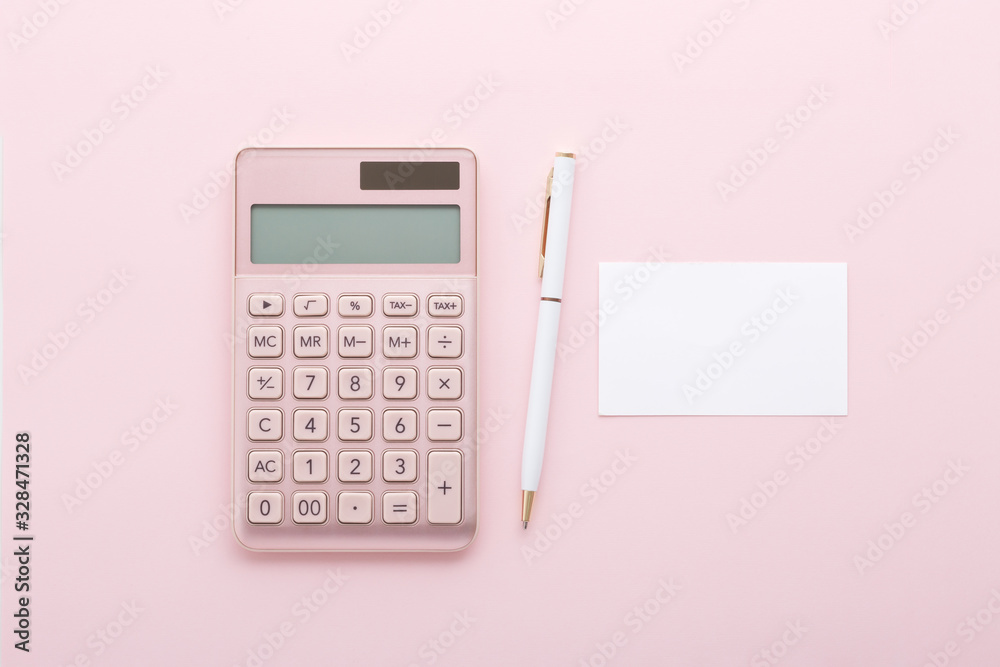 Rose gold calculator with pen and business card on pink background, flat lay Rose gold calculator with pen and business card on pink background, flat lay