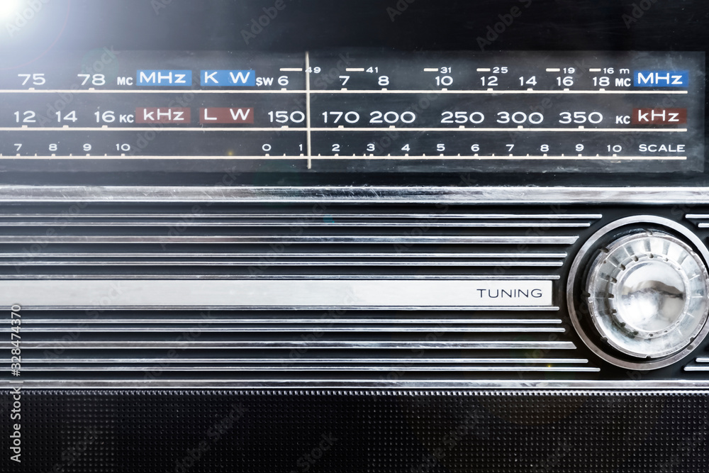 An old radio frequency tuning in abstract style. Retro background. Retro music concept. Music radio sound wave. Classic vintage design. Radio station signal. An old radio frequency tuning in abstract style. Retro background. Retro music concept. Music radio sound wave. Classic vintage design. Radio station signal.
