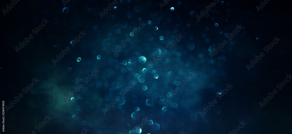 Obraz premium background of abstract glitter lights. gold, blue and black. de focused