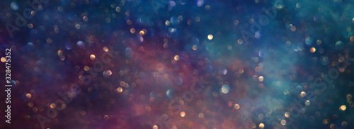 background of abstract glitter lights. gold, blue and black. de focused